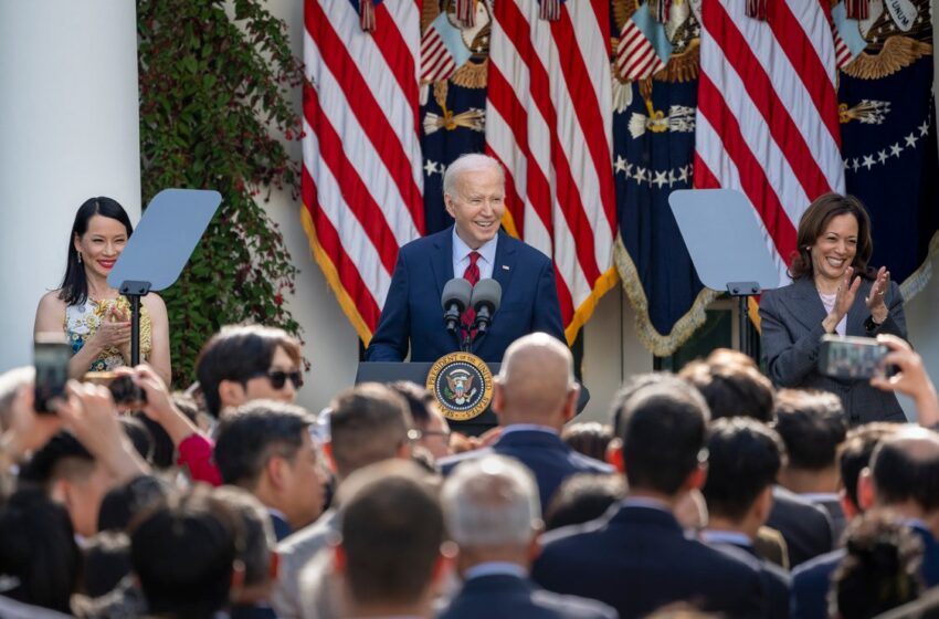 As Vice President Kamala Harris looks on, President Joe Biden addresses a White House event celebrating Asian American, Native Hawaiian, and Pacific Islander communities, on May 13, 2024.